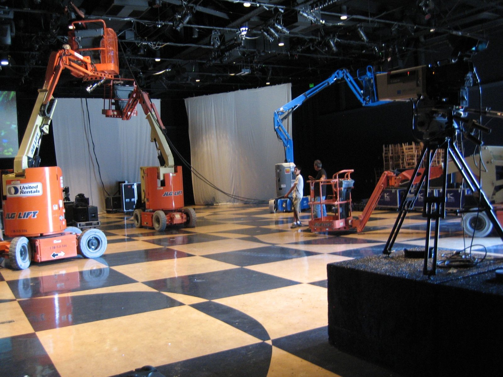 Globe Theatre event load in with lifts, staging, projection equipment, and production crews